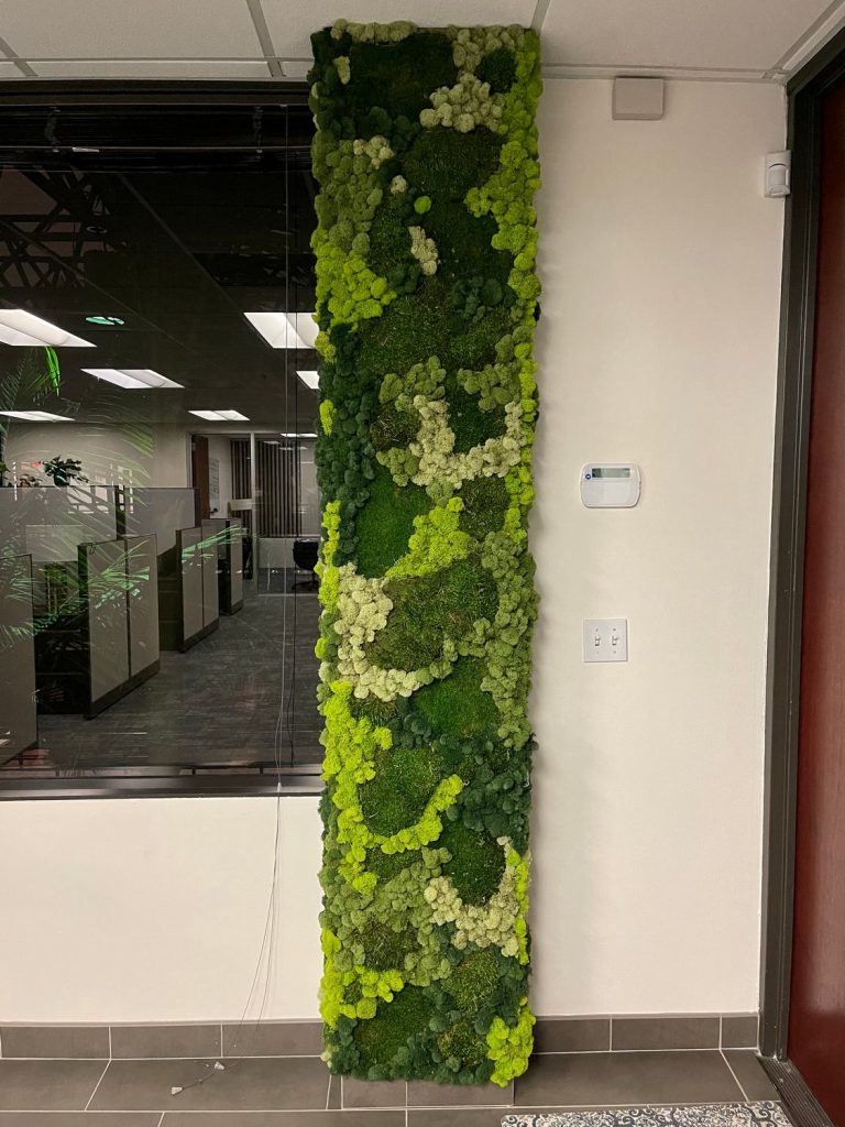 Moss-wrapped pillar for corporate office