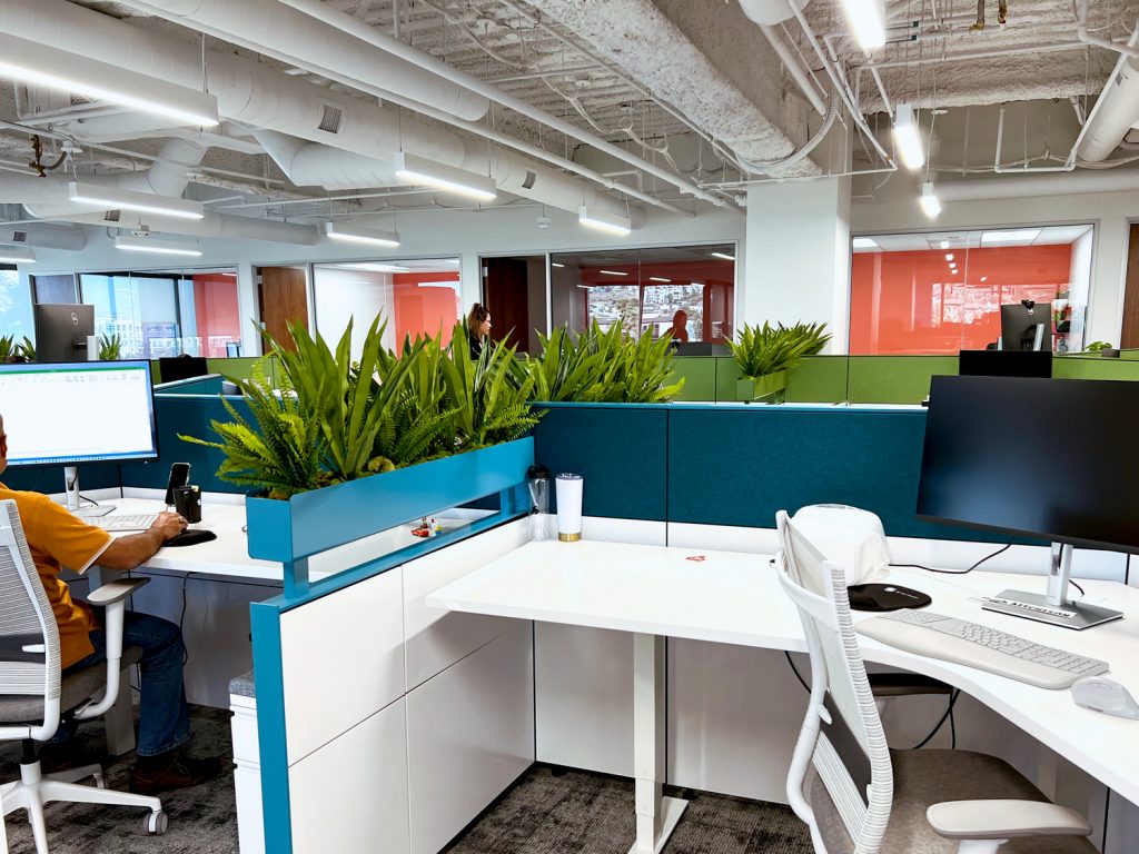 Office workstations accented with silk plants